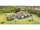 Stunning aerial view of a luxury home, showcasing its grand architecture and meticulously landscaped grounds at 12405 Stonelake Ranch Blvd, Thonotosassa, FL 33592