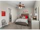 Cozy bedroom with carpet, ceiling fan and a connected bathroom at 12405 Stonelake Ranch Blvd, Thonotosassa, FL 33592