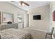 Bedroom with a dresser, a television and a large window at 12405 Stonelake Ranch Blvd, Thonotosassa, FL 33592