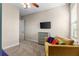 Bedroom with a couch and gray dresser at 12405 Stonelake Ranch Blvd, Thonotosassa, FL 33592