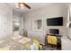 Bedroom with a yellow and grey bedding set and a workspace at 12405 Stonelake Ranch Blvd, Thonotosassa, FL 33592
