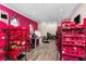 Bright craft room with pink walls and ample storage at 12405 Stonelake Ranch Blvd, Thonotosassa, FL 33592