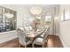 Refined dining room features a wine cellar, a chandelier, and a large window with natural light at 12405 Stonelake Ranch Blvd, Thonotosassa, FL 33592