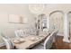 Elegant dining room boasts a decorative chandelier, with a view of a second interior space through an arched doorway at 12405 Stonelake Ranch Blvd, Thonotosassa, FL 33592