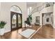 Grand entry with curved staircase and hardwood floors at 12405 Stonelake Ranch Blvd, Thonotosassa, FL 33592