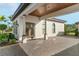 Covered patio with paver driveway, arched windows, and wood ceiling at 12405 Stonelake Ranch Blvd, Thonotosassa, FL 33592