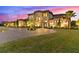 Two-story house with landscaped yard and brick driveway at 12405 Stonelake Ranch Blvd, Thonotosassa, FL 33592