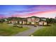 Luxury home with circular driveway and manicured lawn at 12405 Stonelake Ranch Blvd, Thonotosassa, FL 33592