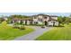 Grand home with a curving driveway and green lawn at 12405 Stonelake Ranch Blvd, Thonotosassa, FL 33592