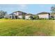 House exterior view, showcasing the backyard and lawn at 12405 Stonelake Ranch Blvd, Thonotosassa, FL 33592