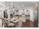 Gourmet kitchen featuring a large island, granite countertops, and custom cabinetry at 12405 Stonelake Ranch Blvd, Thonotosassa, FL 33592