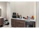 Small kitchenette with microwave, coffee maker, and mini-fridge at 12405 Stonelake Ranch Blvd, Thonotosassa, FL 33592