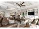 Spacious living room with hardwood floors, large windows, and built in shelving at 12405 Stonelake Ranch Blvd, Thonotosassa, FL 33592