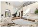 Open living area showcasing a grand staircase, high ceilings, and hardwood floors at 12405 Stonelake Ranch Blvd, Thonotosassa, FL 33592