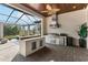 Modern outdoor kitchen with grill and bar at 12405 Stonelake Ranch Blvd, Thonotosassa, FL 33592