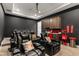 Home theater featuring comfortable leather recliners, a projector, and a concession stand at 12405 Stonelake Ranch Blvd, Thonotosassa, FL 33592