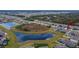 Aerial view of home and community features, including a lake and neighborhood at 12940 Brookside Moss Dr, Riverview, FL 33579