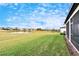 Spacious backyard with pond view and lush grass at 12940 Brookside Moss Dr, Riverview, FL 33579
