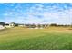 Serene backyard with pond and neighborhood view at 12940 Brookside Moss Dr, Riverview, FL 33579