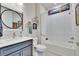 Clean bathroom with a tub, vanity, and stylish mirror at 12940 Brookside Moss Dr, Riverview, FL 33579