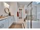 Elegant bathroom with double vanity, walk-in shower, and soaking tub at 12940 Brookside Moss Dr, Riverview, FL 33579