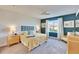 Spacious bedroom with a king-size bed and yellow comforter at 12940 Brookside Moss Dr, Riverview, FL 33579