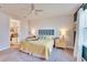 Bright bedroom with a king-size bed and en-suite bathroom access at 12940 Brookside Moss Dr, Riverview, FL 33579