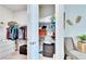 Large walk-in closet with shelving and hanging rods at 12940 Brookside Moss Dr, Riverview, FL 33579