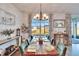 Elegant dining room with a wooden table and a view at 12940 Brookside Moss Dr, Riverview, FL 33579