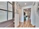 Bright and spacious entryway with wood floors and stylish wall decor at 12940 Brookside Moss Dr, Riverview, FL 33579