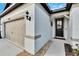 House exterior showcasing a two-car garage and walkway leading to the front door at 12940 Brookside Moss Dr, Riverview, FL 33579