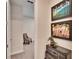 Home hallway with chair and decorative storage cabinet at 12940 Brookside Moss Dr, Riverview, FL 33579