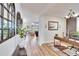 Bright home office with wood desk and view to living room at 12940 Brookside Moss Dr, Riverview, FL 33579