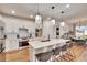 Modern kitchen with white cabinets, quartz countertops and stainless steel appliances at 12940 Brookside Moss Dr, Riverview, FL 33579