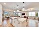 Large kitchen island with seating and a double sink at 12940 Brookside Moss Dr, Riverview, FL 33579