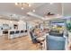 Open concept kitchen and living area with island and hardwood floors at 12940 Brookside Moss Dr, Riverview, FL 33579