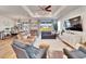 Bright and airy living room with hardwood floors and comfortable seating at 12940 Brookside Moss Dr, Riverview, FL 33579