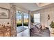 Comfortable living room with sliding glass doors to backyard at 12940 Brookside Moss Dr, Riverview, FL 33579