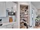 Well-organized pantry with ample shelving for storage at 12940 Brookside Moss Dr, Riverview, FL 33579