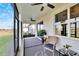 Bright and airy screened porch with seating area at 12940 Brookside Moss Dr, Riverview, FL 33579