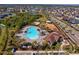 Community pool, playground and clubhouse with surrounding homes at 13614 Tonya Anne Dr, Riverview, FL 33579
