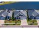 Three homes with similar design, situated on a lakefront street at 13614 Tonya Anne Dr, Riverview, FL 33579