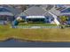Aerial view of home with screened patio, fence and lake view at 13614 Tonya Anne Dr, Riverview, FL 33579