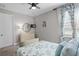 Bedroom with dresser, TV and a comfy bed at 13614 Tonya Anne Dr, Riverview, FL 33579