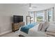 Spacious bedroom with a large TV and plenty of natural light at 13614 Tonya Anne Dr, Riverview, FL 33579
