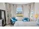 Bright bedroom with two comfy armchairs and a view at 13614 Tonya Anne Dr, Riverview, FL 33579