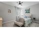 Guest bedroom with a comfy bed and sitting area at 13614 Tonya Anne Dr, Riverview, FL 33579