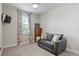 Small bedroom with a sofa and window at 13614 Tonya Anne Dr, Riverview, FL 33579