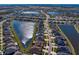 Aerial view of a large community with lake and various homes at 13614 Tonya Anne Dr, Riverview, FL 33579