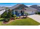 One-story house with two-car garage, landscaping, and walkway at 13614 Tonya Anne Dr, Riverview, FL 33579